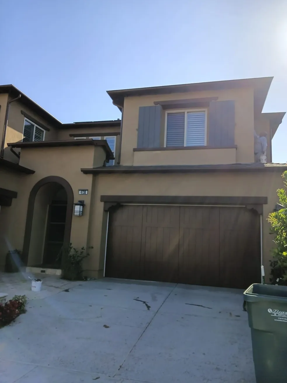 Aragon Professional Painting crew painting the exterior of a two story Lake Forest home